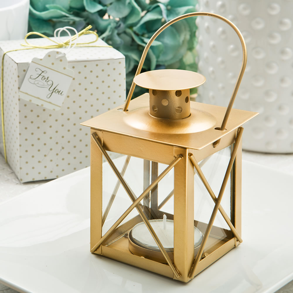 Love lights the way luminous lantern in a matte gold finish