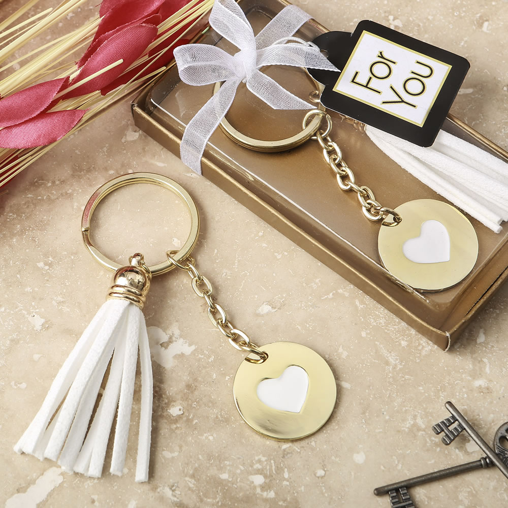 Gold metal heart themed white tassel key chain